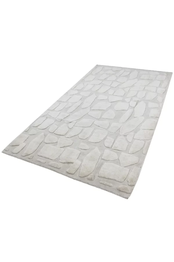 Unser Snow Print Teppich ist eine Kombination aus zwei Herstellungstechniken, Flachgewebe und Hochflor. Das Design besticht durch subtile Variationen in der Florhöhe und ist in einer wunderschönen Cremefarbe gehalten. Middleway Gallery, Hamburg, Online Shop